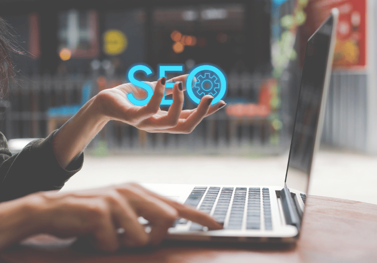 10 SEO Myths Debunked: 2025 Edition | Woman holding the words SEO and working on a computer | Netvolution